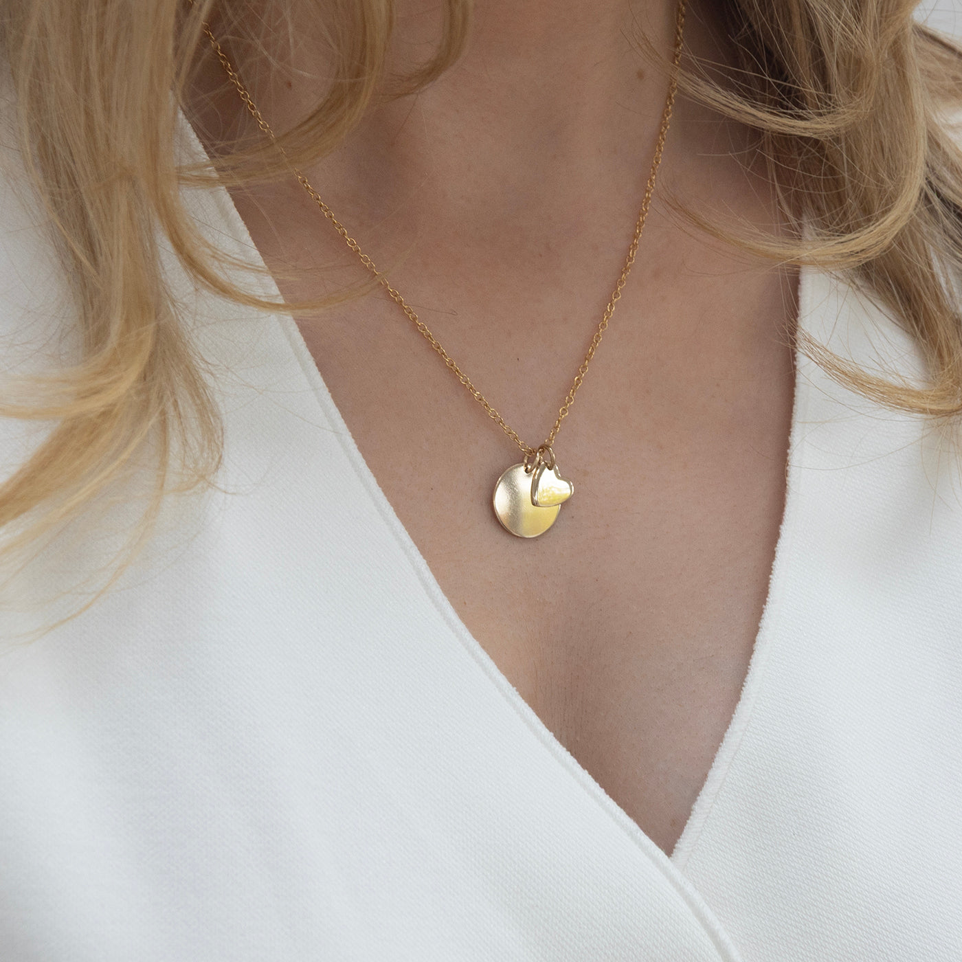 gold midi name and heart necklace. lulu and belle