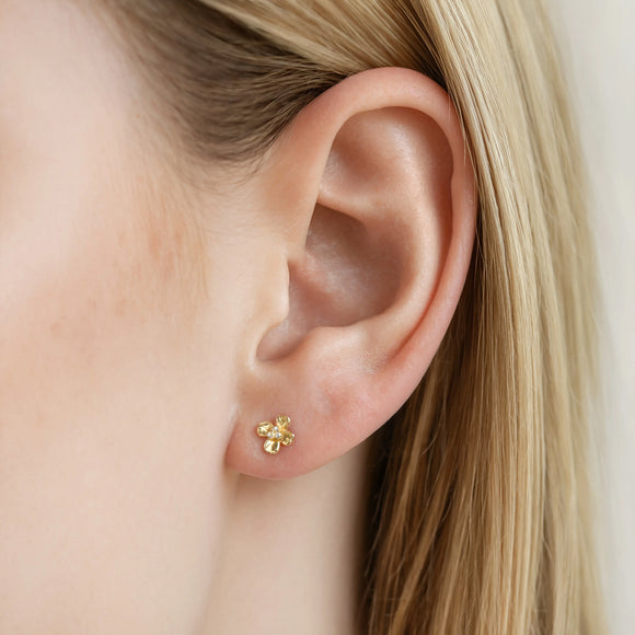 9ct gold flower stud earrings, four-petal design with cubic zirconia centre detail, shown from the front and in profile