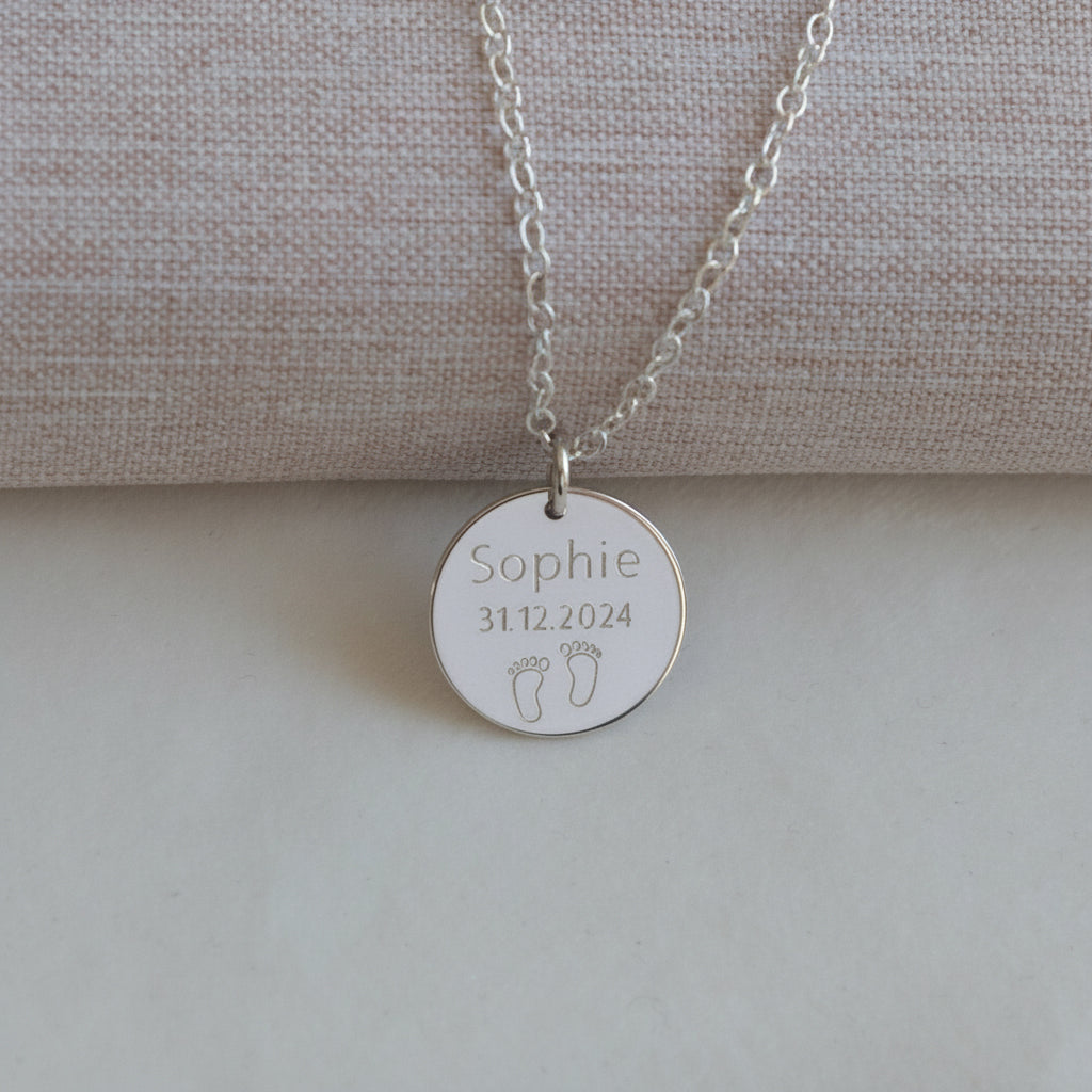 name necklace with baby's date of birth and feet in silver 