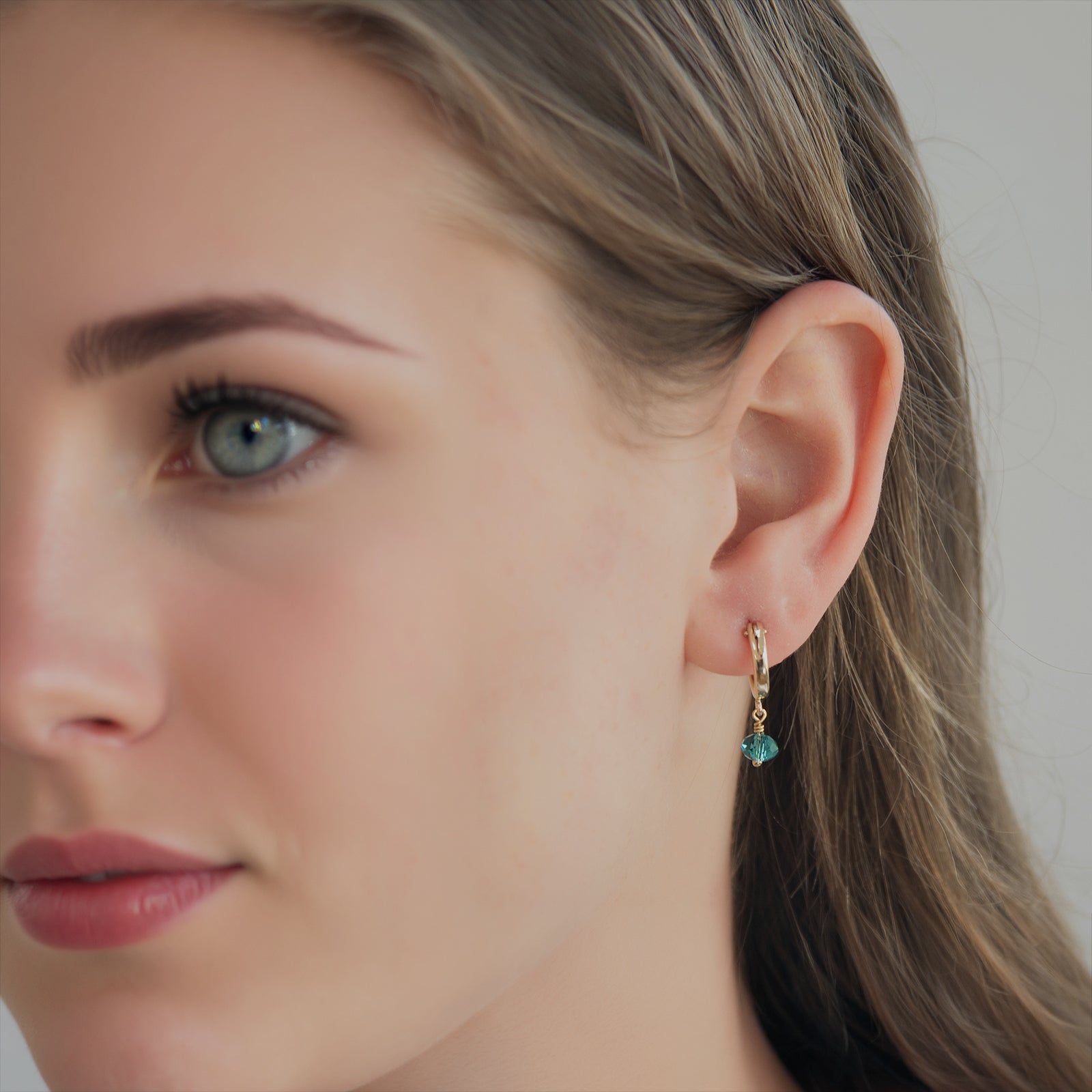 december birthstone hoop earrings on a model 