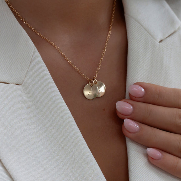medium gold initial necklace two or more discs 
