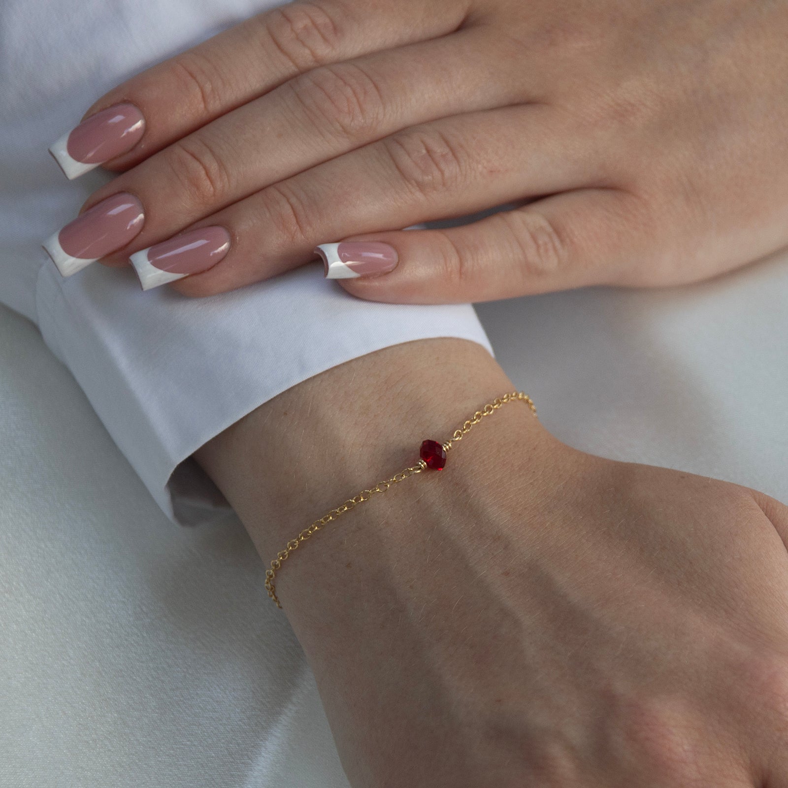 july birthstone bracelet gold on a model 