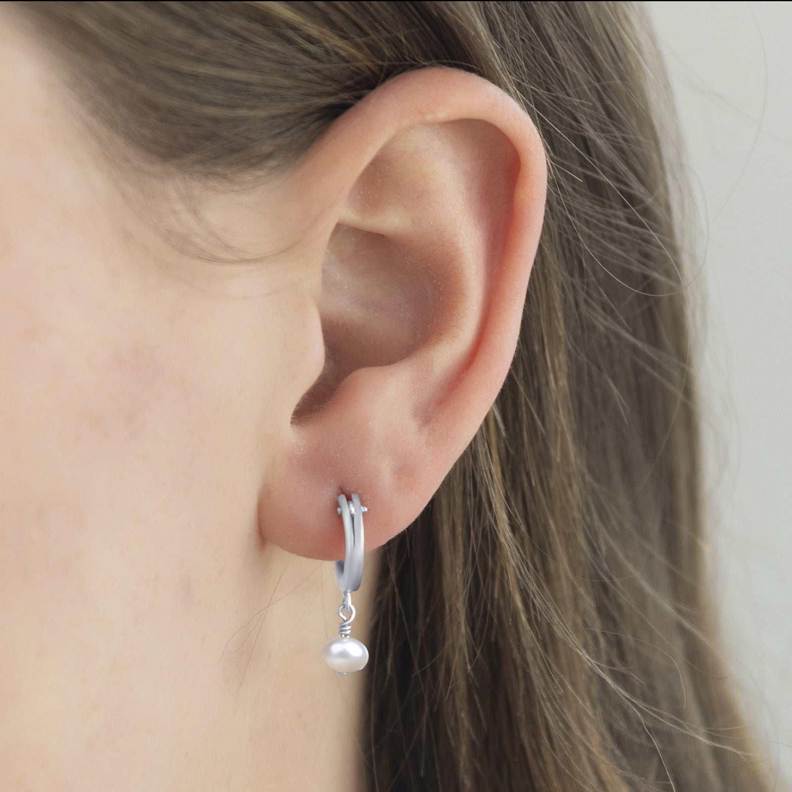 June_birthstone_hoop_earring_on_a_model_close_up_Silver
