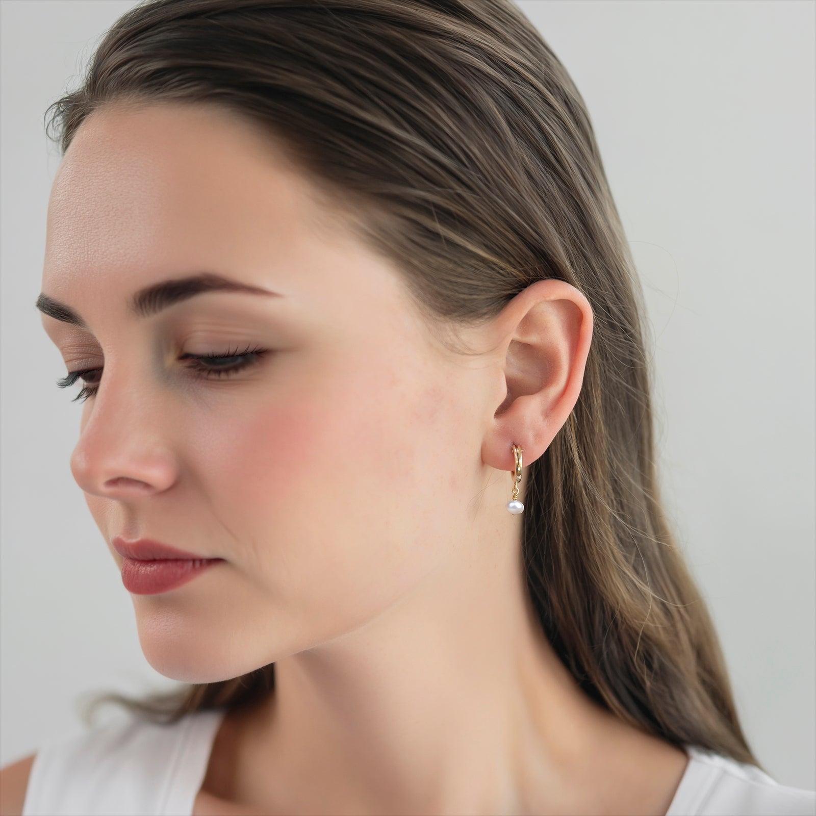 june birthstone hoop earring on a model 