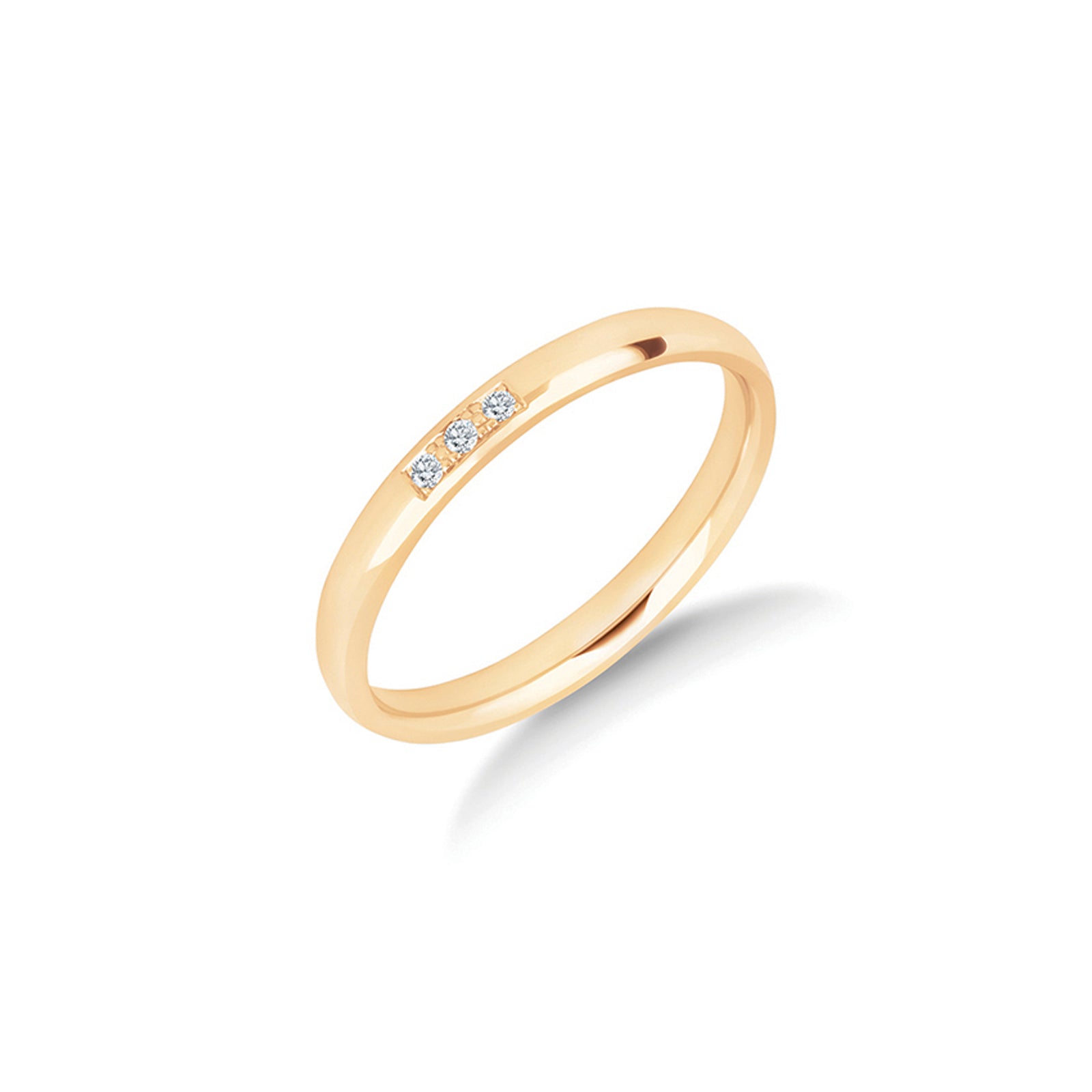 The Anam Cara diamond wedding ring in yellow gold, three pavé set brilliant cut diamonds set close together and centred on a slender 2.5mm ring