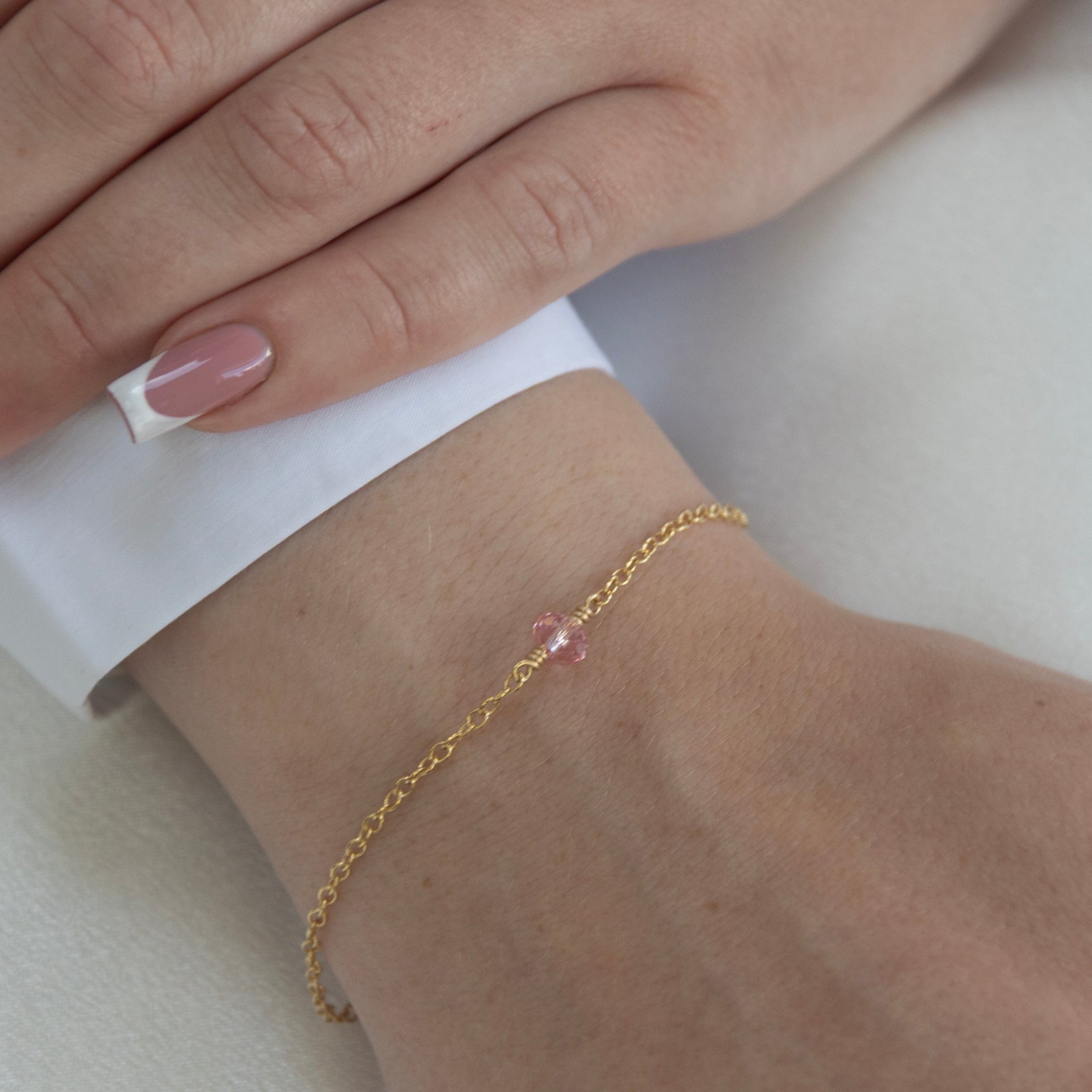October birthstone bracelet gold on a model 
