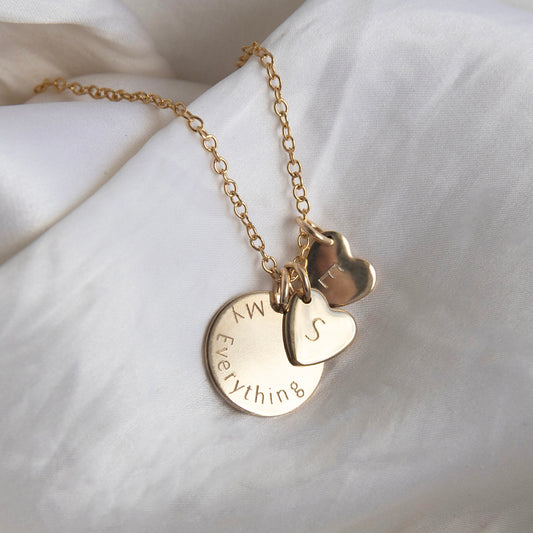 Personalised necklace with disc and hearts gold. Lulu and belle