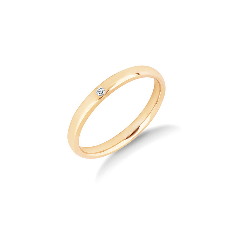 The One diamond wedding ring in yellow gold, a single bezel set diamond in a slender 2.5mm polished ring