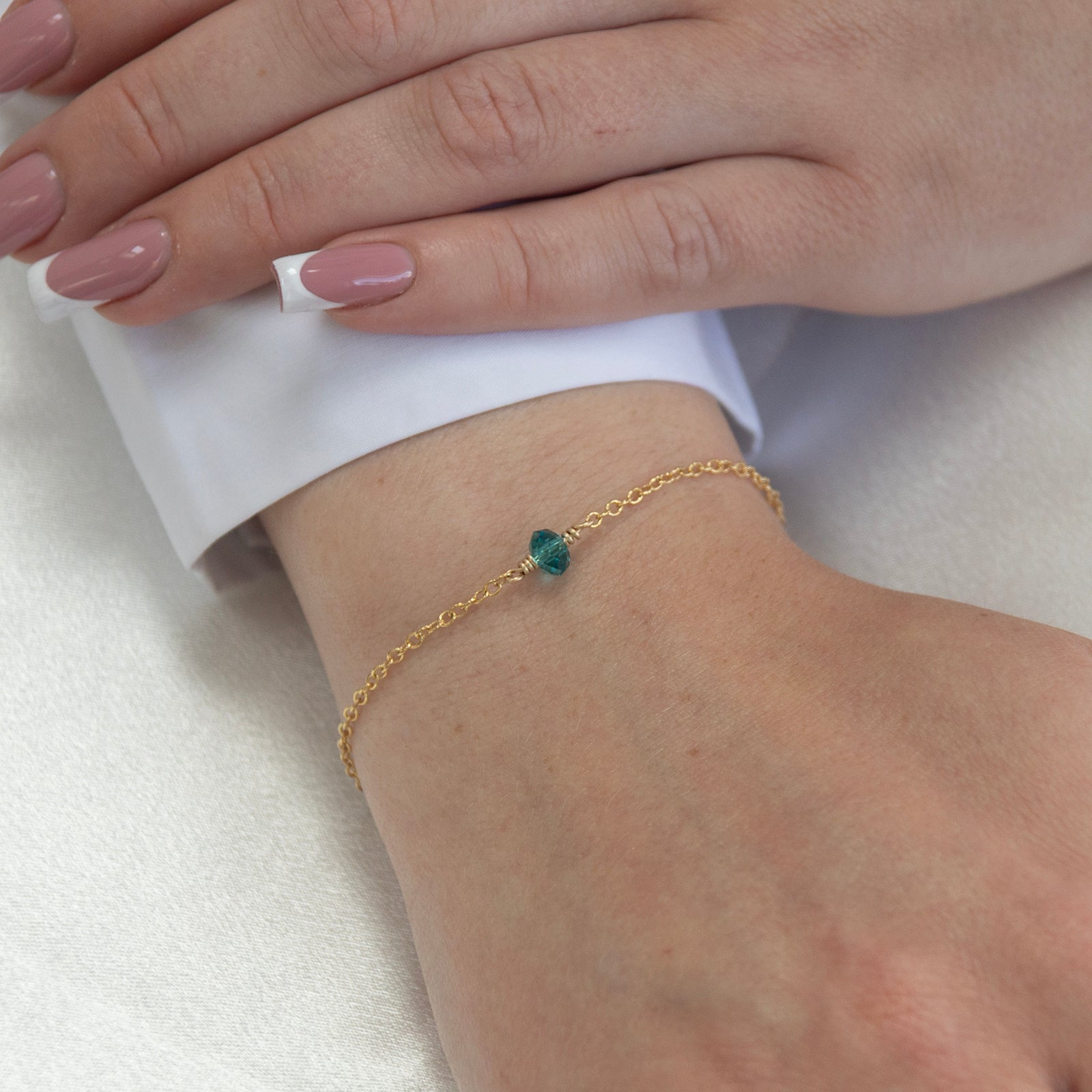 december birthstone bracelet gold on a model 