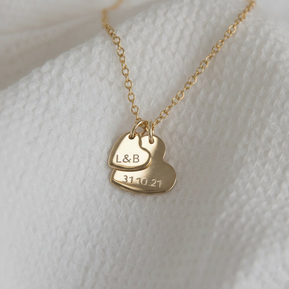 gold double heart necklace with initial and date 
