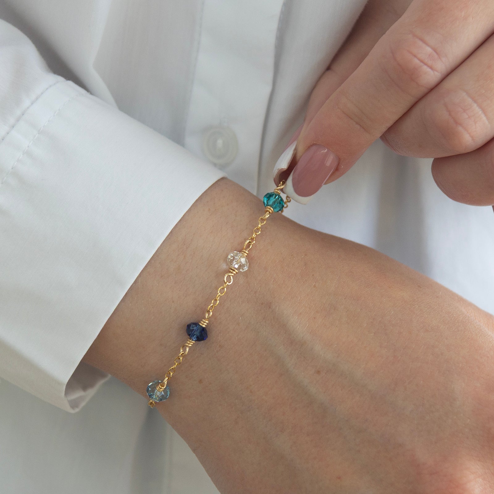 family birthstone bracelet with 4 stones on a model 