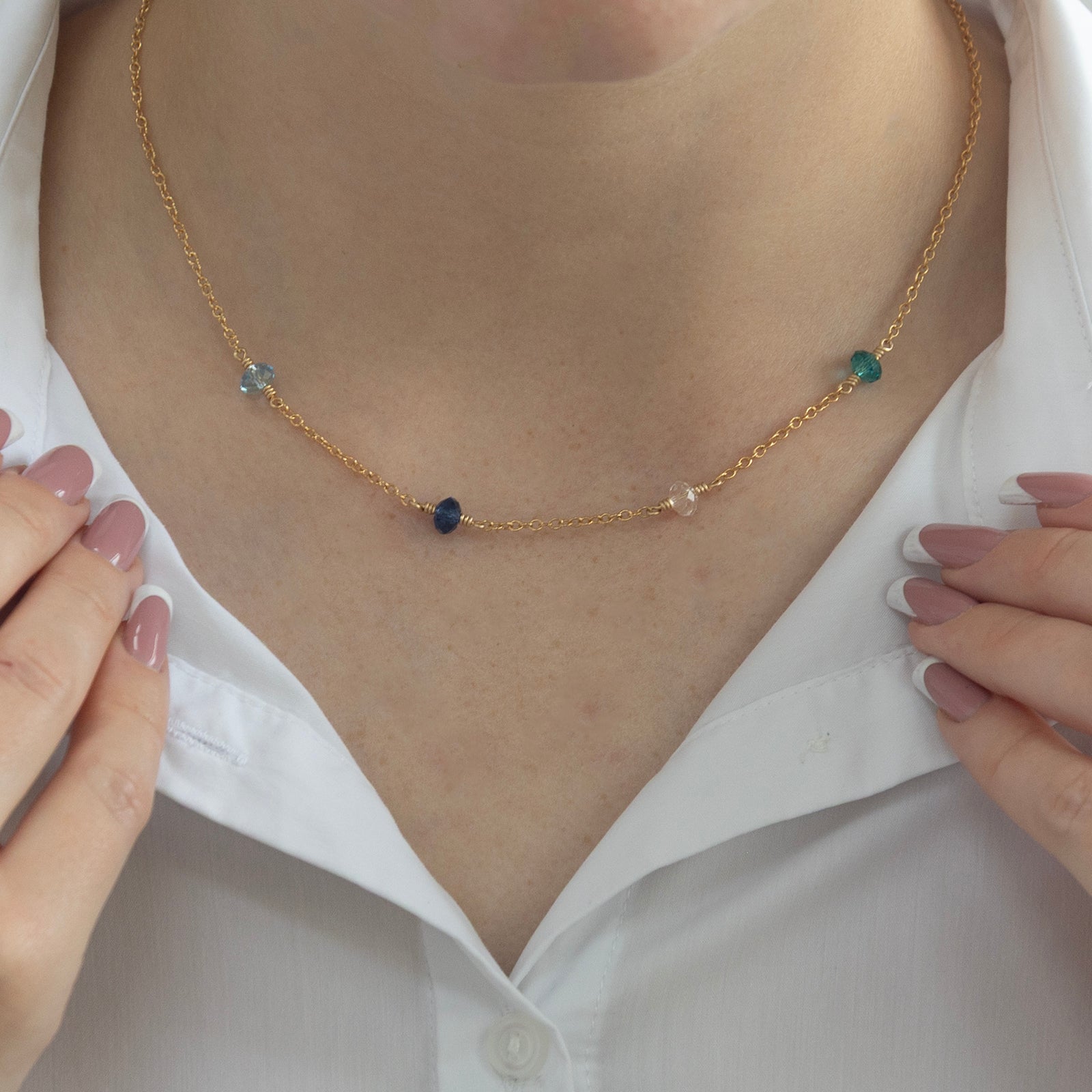 family birthstone necklace gold with 4 stones on a model 