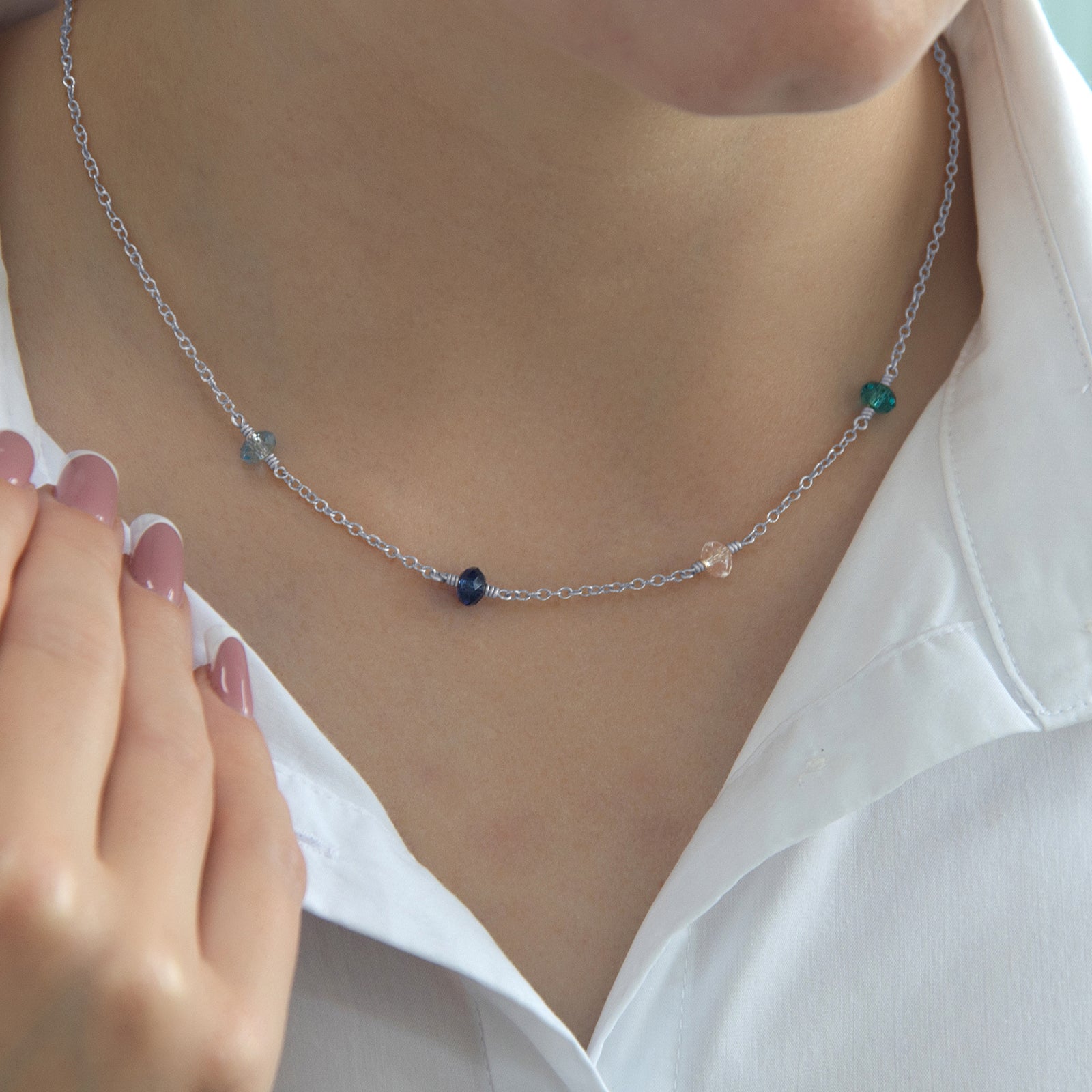 family_birthstone_necklace_with_four_stones_on_a_model_lifestyle_Silver