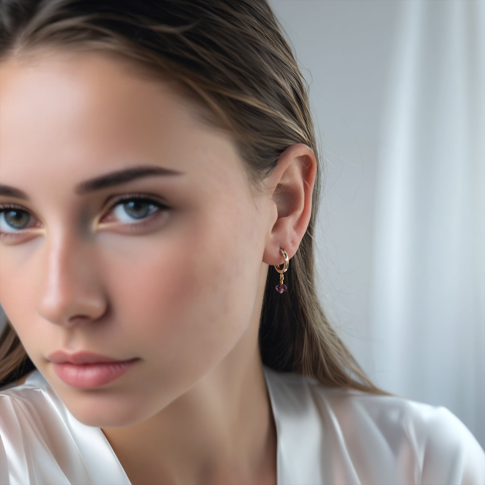 february birthstone earrings on a model 
