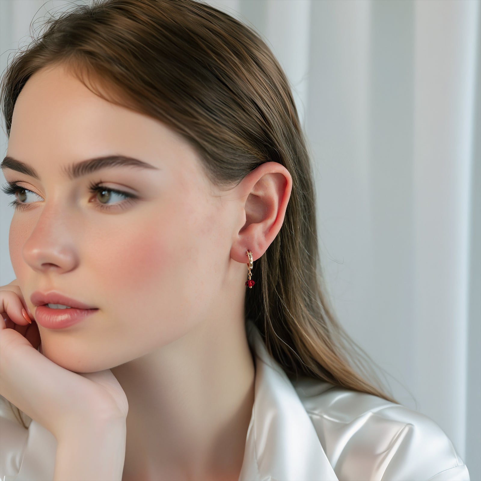 january birthstone hoop earring in gold on a model 