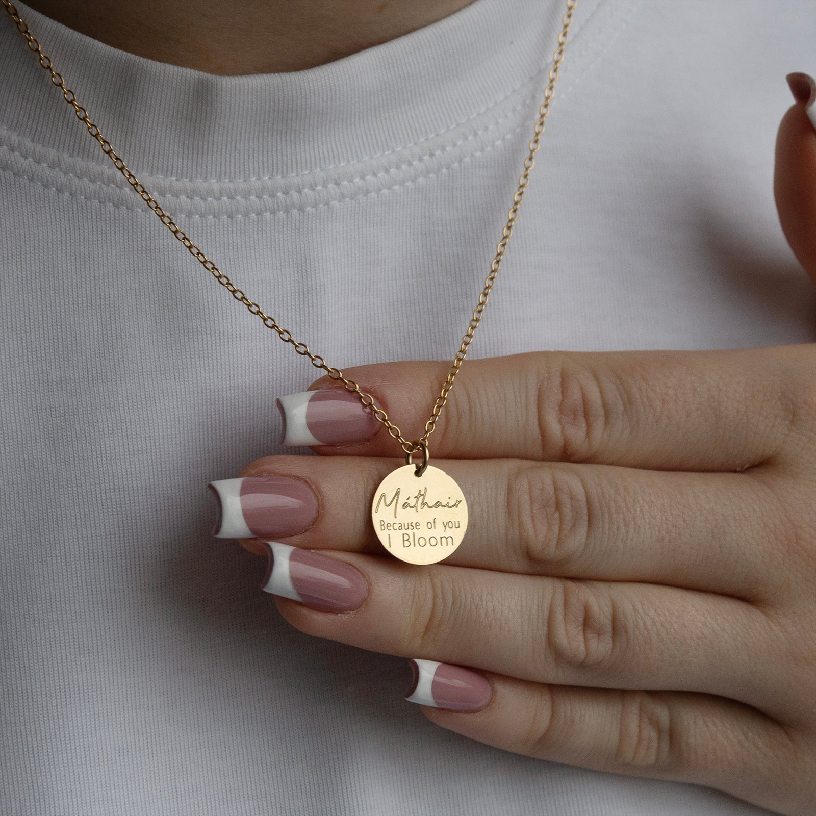 mathair bloom necklace from the back in gold on a models neck 