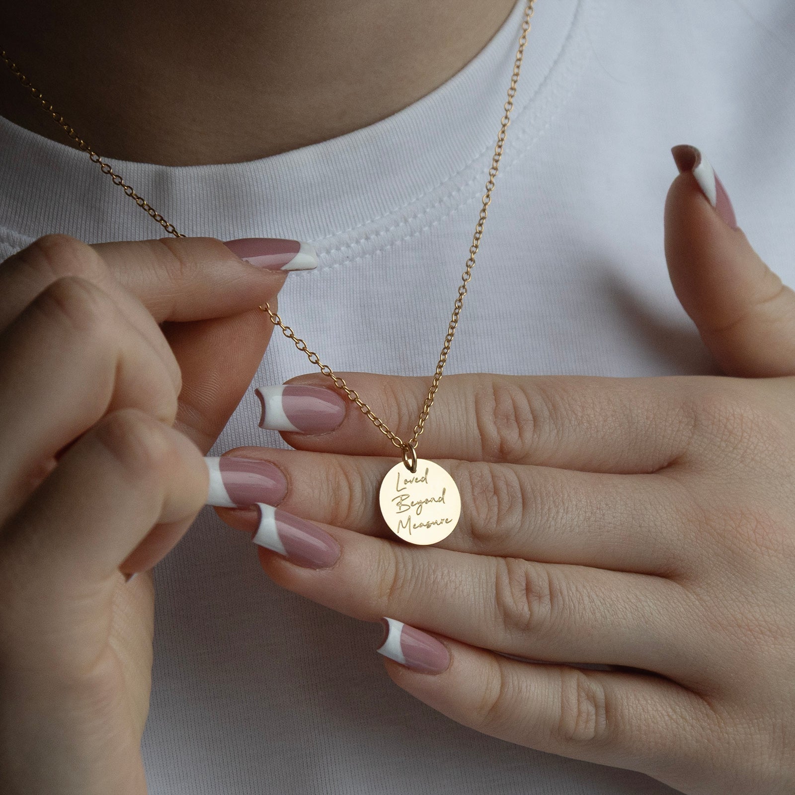 personalised necklace for grandmother from back in gold on a models hand 