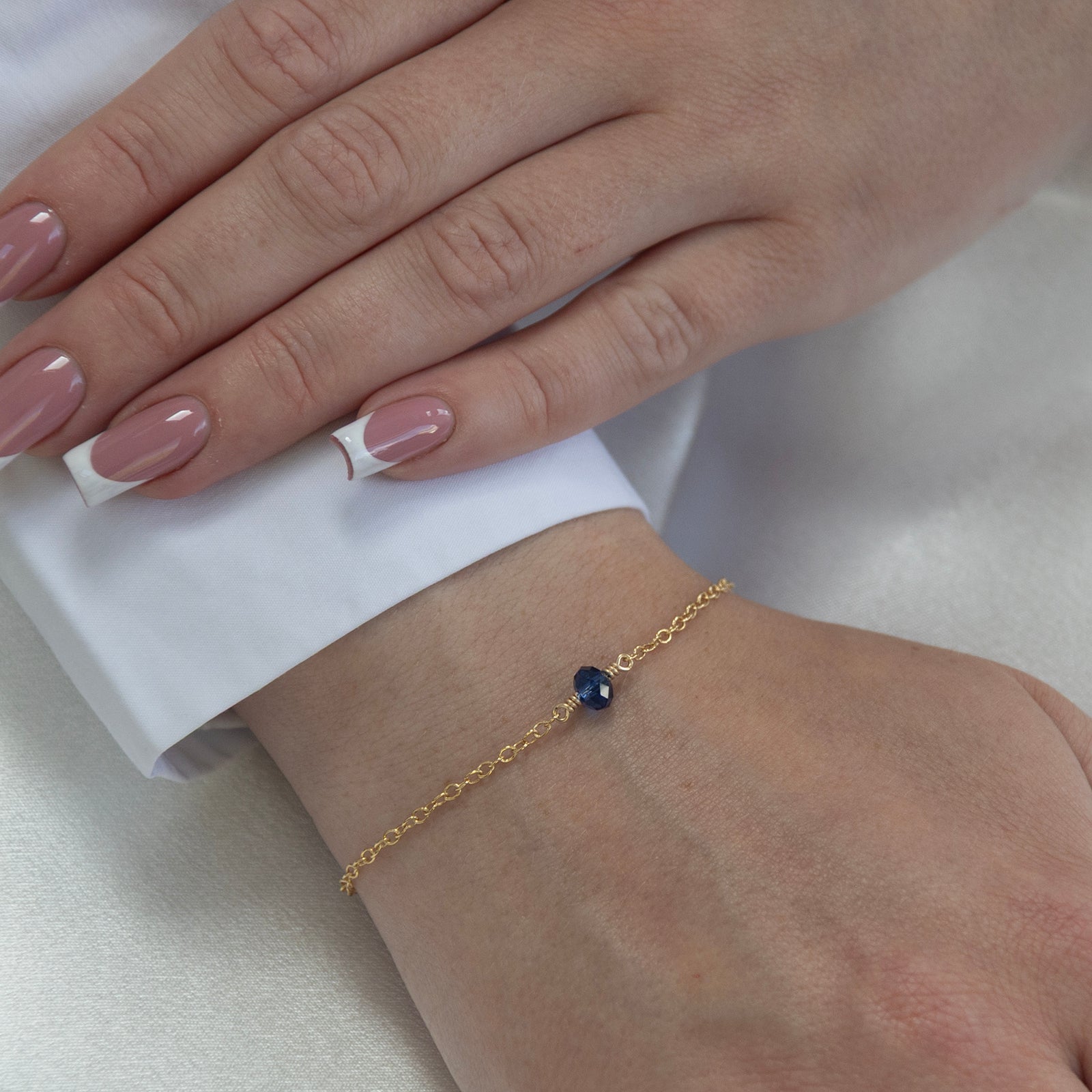 september birthstone bracelet gold on a model 