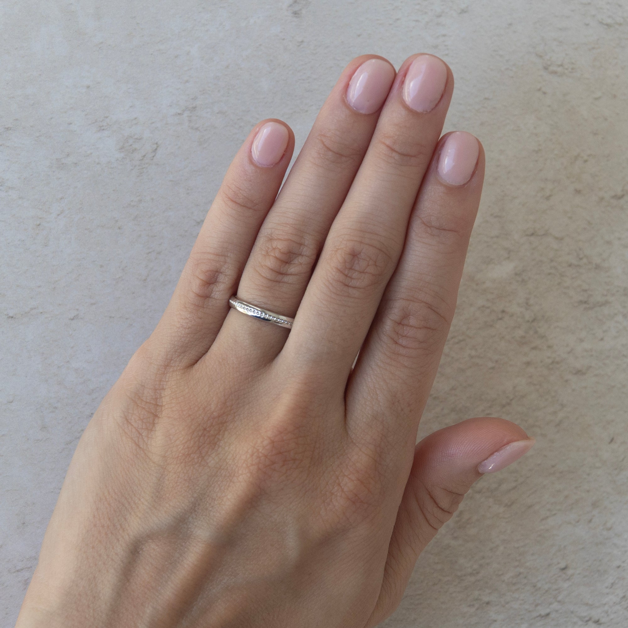 the first light wedding ring on a model 
