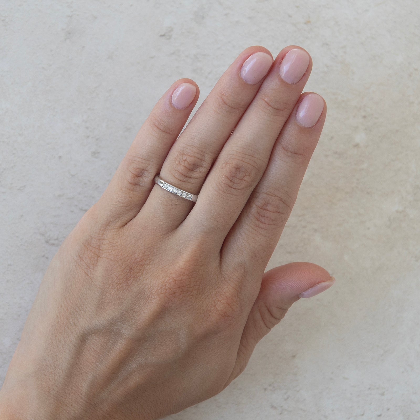 the promise wedding ring platinum worn by a model 