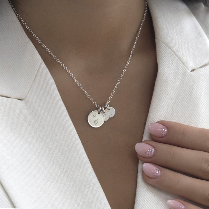 Star Family Initial Necklace worn with a cream blazer